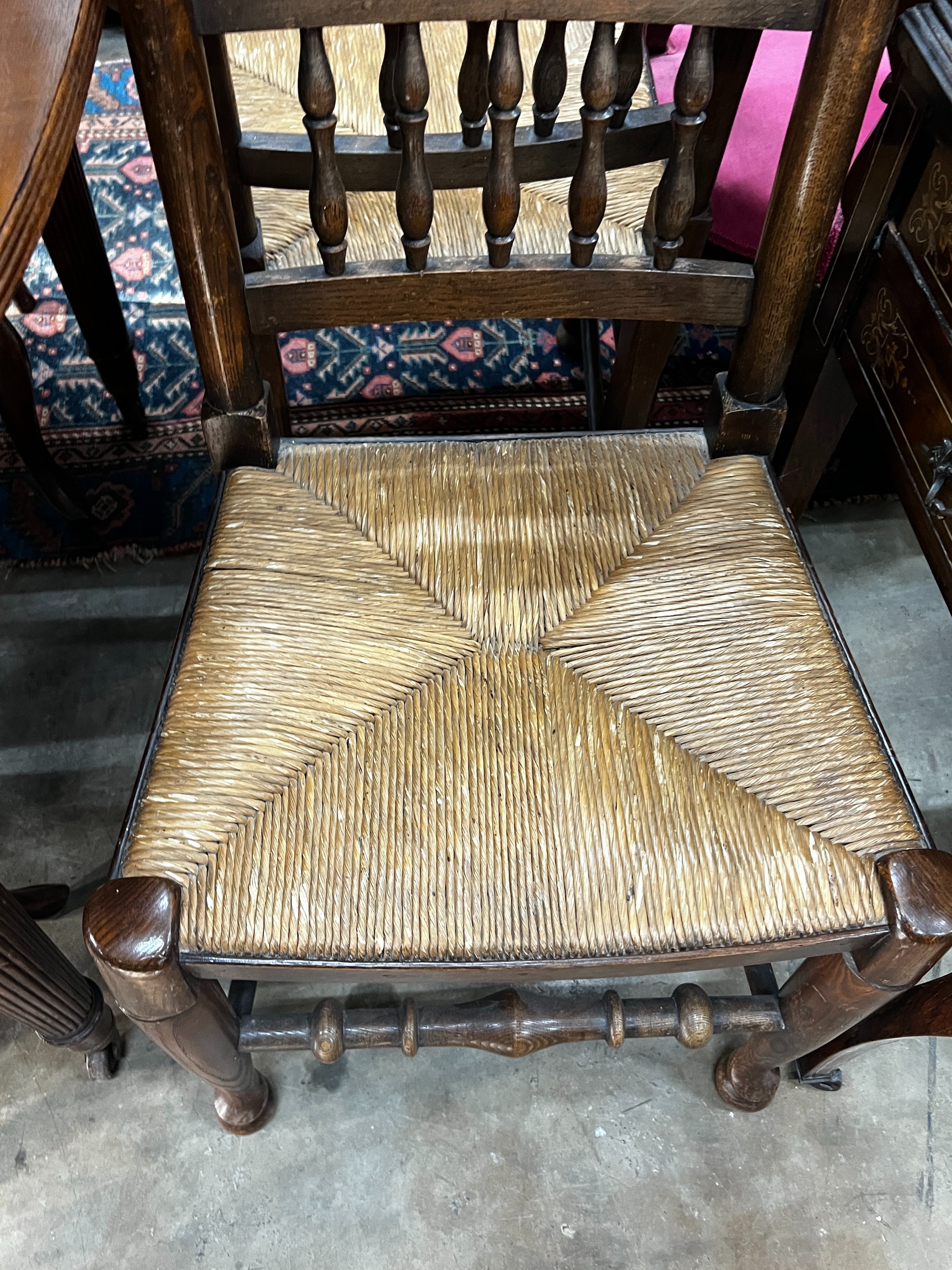 A pair of Lancashire elm and beech rush seat chairs